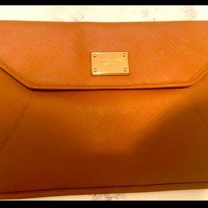 MK clutch can fit I pad and use for a purse added loops to the side for chain.